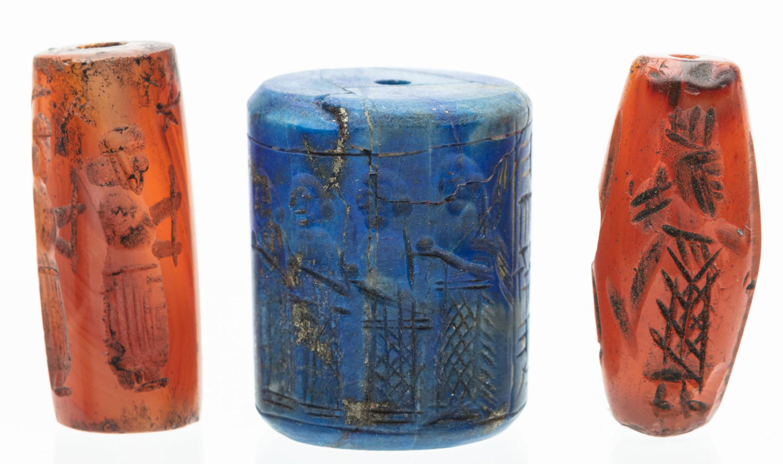 Trio of Near Eastern Cylinder Seals: One of Lapis: Trio of Near Eastern Cylinder Seals: One of Lapis Luzuli and Two of Carnelian. Three appealing Near Eastern cylinder seals, which, while age is uncertain, certainly have great appeal and could be inco