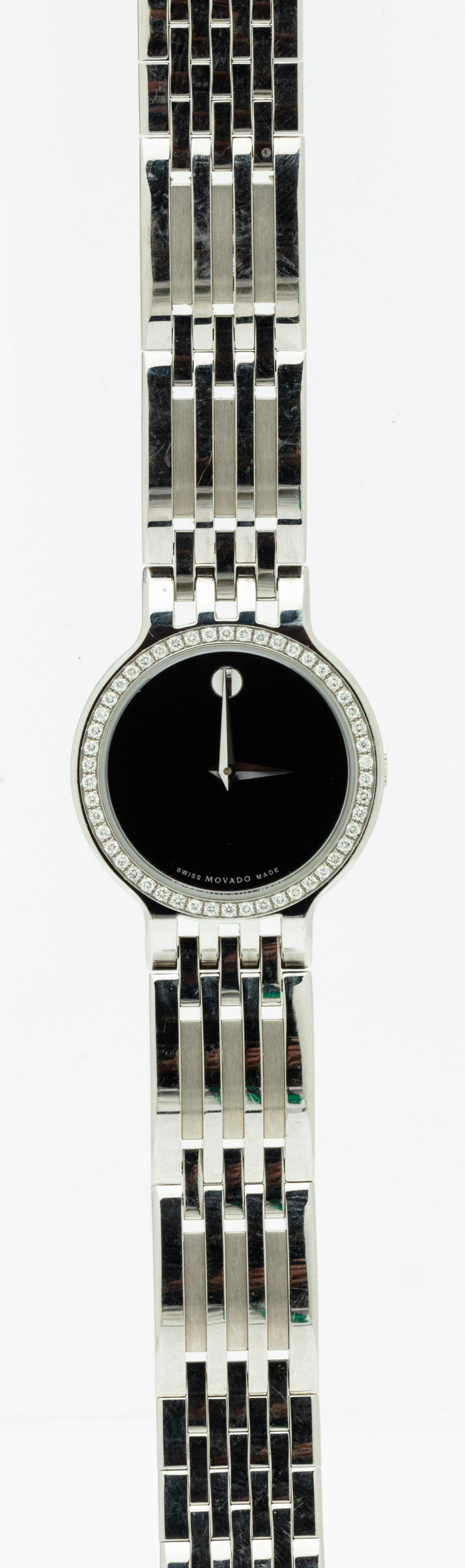 Lady's Movado "Esperanza" Stainless Steel and Diamond: Lady's Movado "Esperanza" Stainless Steel and Diamond Watch. Swiss made, silver-tone stainless steel case with a silver-tone stainless steel bracelet and fixed diamond bezel. Black museum dial with si