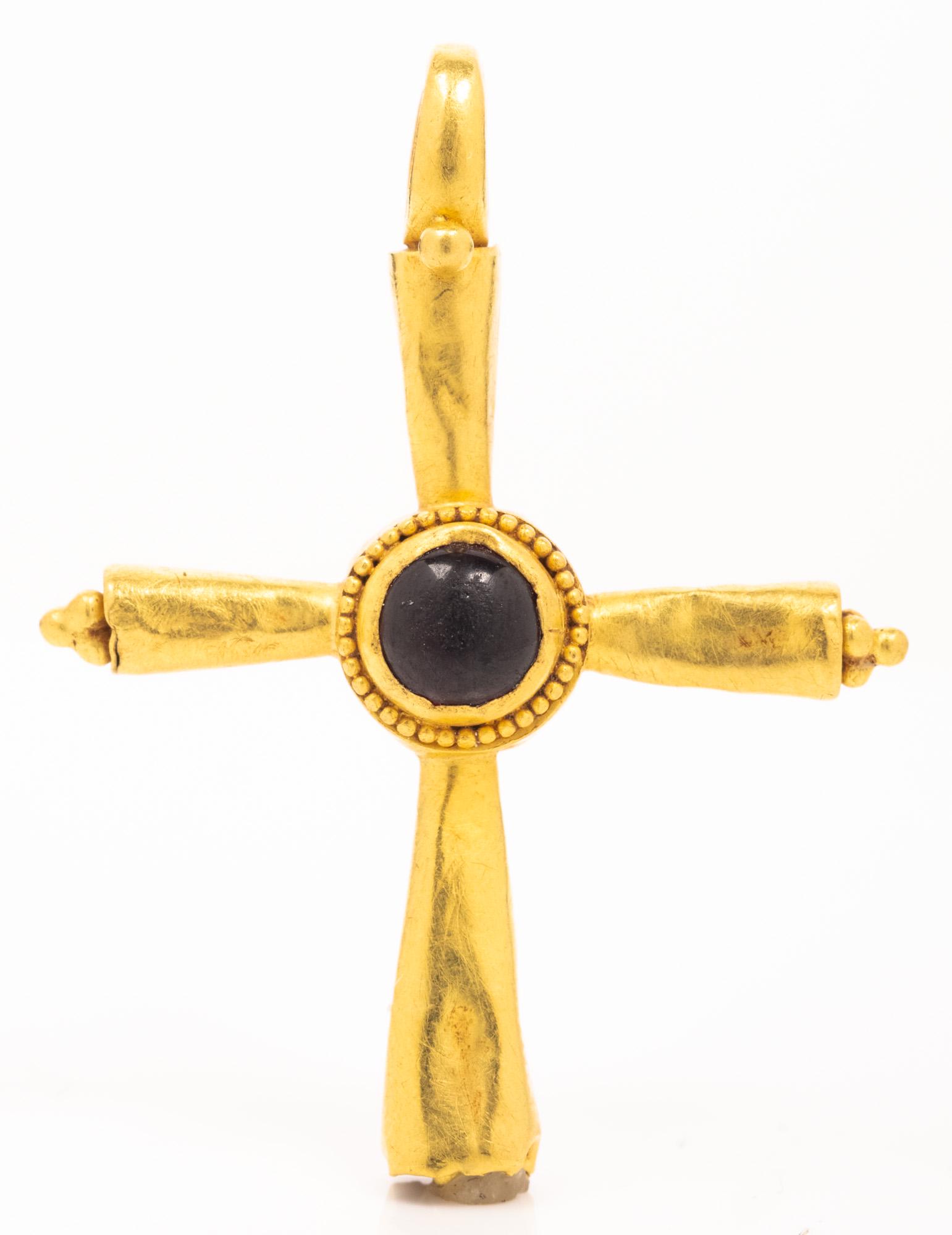 Byzantine, ca. 6th-8th Century, 22K Gold Cross inset: Byzantine, ca. 6th-8th Century, 22K Gold Cross inset with Garnet. Superb condition. Size: 30mm, Weight: 2.90 grams. From the property of an East Coast Collector, acquired prior to 1979. Estimated Valu