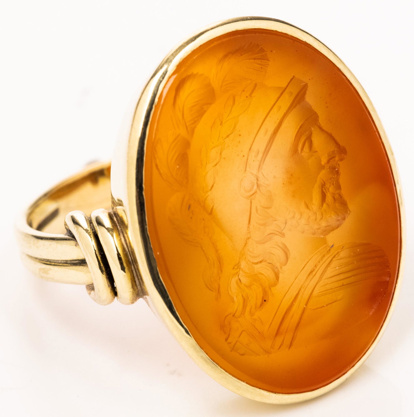 Neo Classical, ca. 19th Century, 14K Gold Ring with: Neo Classical, ca. 19th Century, 14K Gold Ring with Carnelian Intaglio. Featuring a helmeted head of a Trojan facing right. A magnificent impressive piece in superb condition. Ring Size 9, Weight: 10.