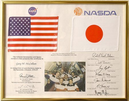 STS-47, 1992, FLOWN US and Japanese Flags: STS-47, 1992, FLOWN US and Japanese Flags (6x4") mounted on a multicolor presentation sheet (framed to 14x11.5") with the inscription: "These flags were flown on Mission ST