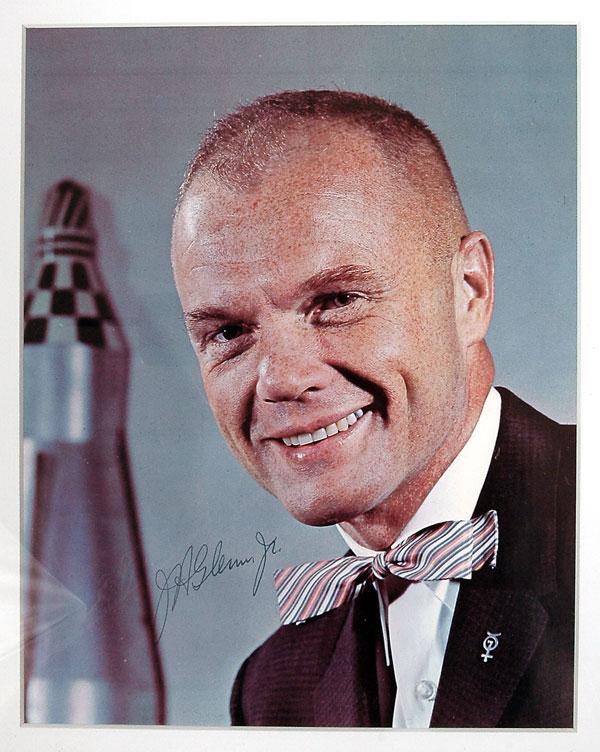 MA-6, 1962, John Glenn Autograph: MA-6, 1962, John Glenn Autograph. On a color photo (matted and framed to 11x13") of him wearing a striking bow tie and a Mercury 7 lapel pin. Clean and attractive. Estimated Value $150