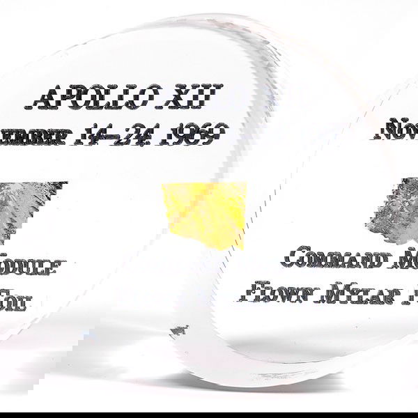 Apollo 12, 1969, FLOWN Gold Foil: Apollo 12, 1969, FLOWN Gold Foil (.5x.25") mounted in a clear lucite cylinder (2.5x1") that is engraved on the bottom: "Apollo XII / Nobember 14-24, 1969 / Command Module /