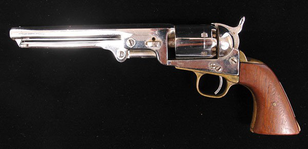 1851 Navy Colt: 1851 Navy Colt. A Navy Colt cap and ball pistol that has been chromed sometime in the past. This pistol has matching numbers (138471) for its parts except brass band from base of hammer throug