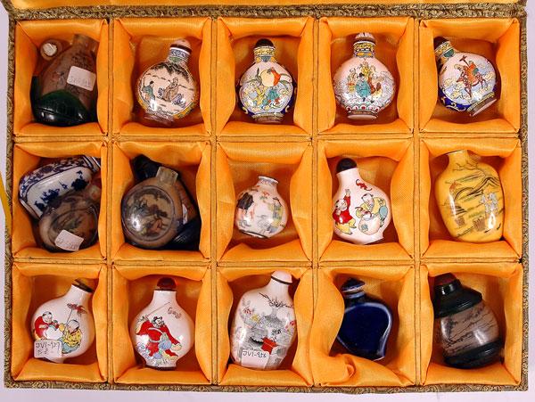 Set of Chinese Snuff Bottles: Set of Chinese Snuff Bottles. Post World War II set of 17 individually hand-painted bottles in original tapestry box. Estimated Value $450 - 600.