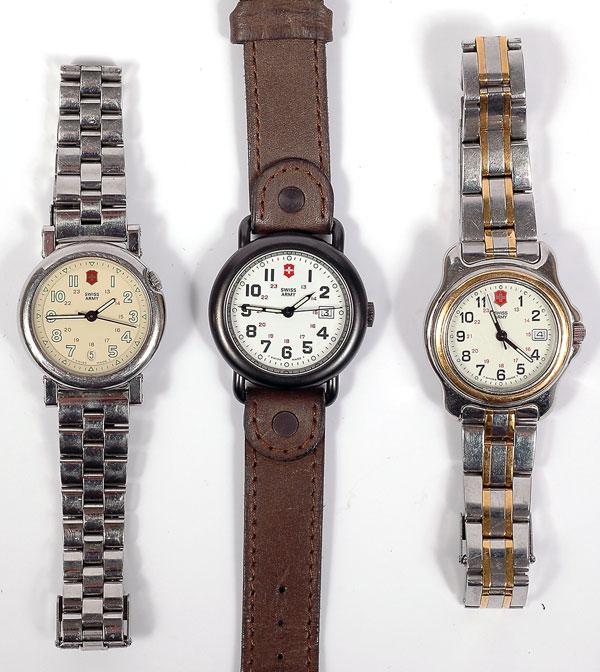 Collection of 3 Swiss Army Watches: Collection of 3 Swiss Army Watches. Including one lady's stainless steel and yellow metal watch with a two tone band; one lady's stainless steel watch and band; one lady's black metal & st