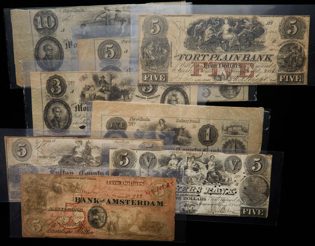 Eight New York Obsoletes Associated with Amsterdam: Eight New York Obsoletes Associated with Amsterdam. Eight various New York obsoletes with an altered $5 Bank of Amsterdam and $5 Farmers Bank of Amsterdam that is punch-cancelled "PAID" are the highli