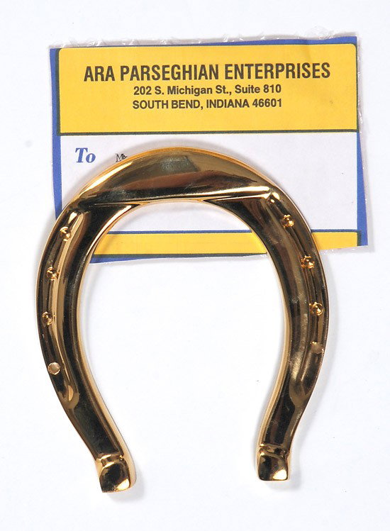 Parseghian, Ara: Parseghian, Ara. A gold-color horseshoe and a handwritten letter, circa 2001, on blue, personal memo paper from the legendary coach to Danny Leeds, a young man suffering from a brain tumor (he die