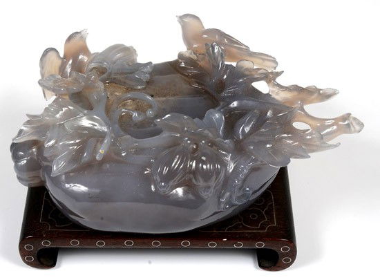 China. Carved Jade figure of birds on a floral wre: China. Carved Jade figure of birds on a floral wreath. Lenght 5". Choice condition. On a custom wooden stand, all in a fitted case. Estimated Value $250 - 350.