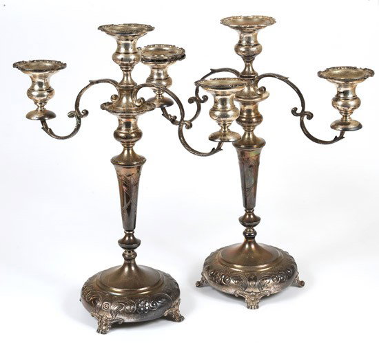 Matched Pair of Sterling Silver Candelabras: Matched Pair of Sterling Silver Candelabras. Height: 15½ in. each, circa mid 20th century. Floral designs and in overall excellent condition. Tarnished with attractive iridescent toning. Total 