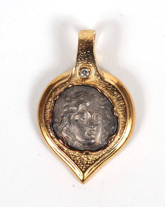 Ancient Greek Silver Drachm In Gold Jeweler's Moun: Ancient Greek Silver Drachm In Gold Jeweler's Mounting. Minted on The Island of Rhodes 386-304 B.C. Mounted on an individually designed 14K gold setting and placed in a leatherette portfolio with 