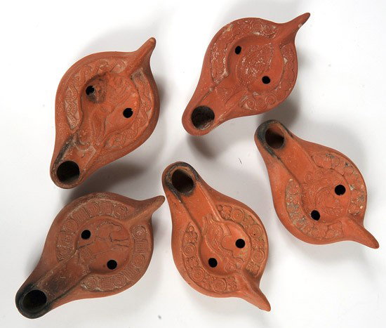 Roman Red-gloss North Africa Oil Lamps: Roman Red-gloss North Africa Oil Lamps. Circa 3rd-4th century AD. Group of 5 different lamps depicting fish (2), horse, lion and a sultan. All in superb condition. Each 5½" in lengt