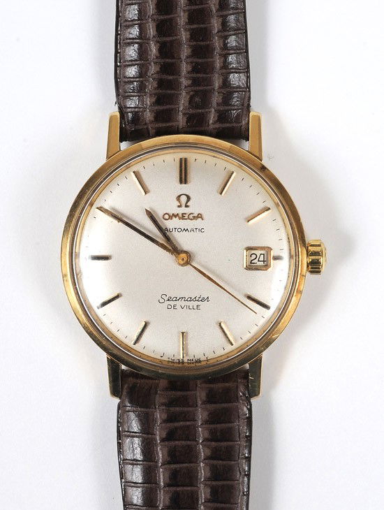 Gent's Omega Seamaster De Ville 14K Yellow Gold Wr: Gent's Omega Seamaster De Ville 14K Yellow Gold Wristwatch. Having an automatic movement, round case, beige dial with gold stick markers, date window, sweep seconds hand, completed by a leather st