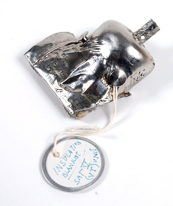 Rockets, 1967, Saturn V Insulation Blanket: Rockets, 1967, Saturn V Insulation Blanket (3x3") made from a piece of folded foil (?) folded foil containing the ID plate from the piece. This reads: "Insulation Blanket / J.J