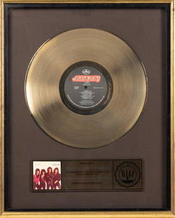 KISS: Original Gold Record Commemoration for the Album "Lick It Up" to the Album's Producer Michael: KISS: Original Gold Record Commemoration for the Album "Lick It Up" to the Album's Producer Michael James Jackson by the RIAA. KISS: The immensely popular and spectacularly theatrical rock/metal band