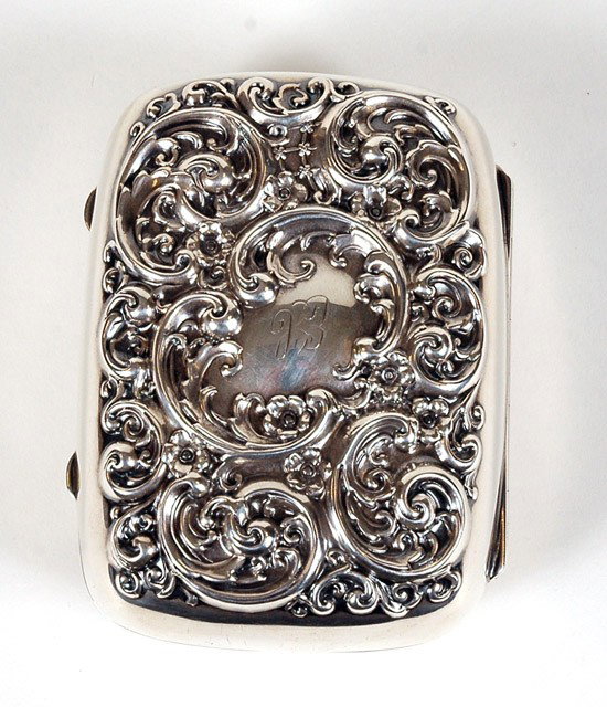 English Sterling Box: English Sterling Box. Measuring 3"x2¼"x1 3/4", has high relief fancy scrolling at it top and bottom and its previous owners initials lightly inscribed on both sides. Total weight is