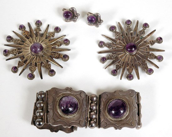 4 Piece Set Of Silver Mexican Jewelry: 4 Piece Set Of Silver Mexican Jewelry. This extraordinary group consists of two star burst design silver and amethyst brooches (3" in diameter), one three piece silver and amethyst bracele
