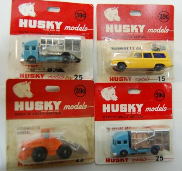4 Vintage Husky cars in Blister Packs: models 15 camera car, two 25s sanitation trucks and 3 orange plow circa 1960s
