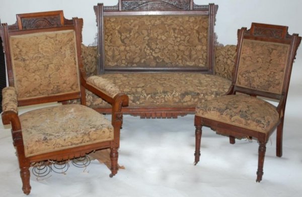 Walnut Victorian Suite, Sofa, Arm Chair, 4 side: chairs. Attractive Walnut w/ very nice detailed carvings and turnings. Needs new upholstery.