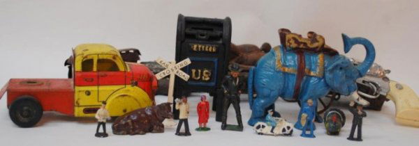 Toys, US Mail Bank, Elephant Bank, R.R. Figures: U.S. Mail Iron Bank, Mechanical Elephant Bank, Max Truck, Vintage Cap gun, cast iron pieces in various conditions. Miniature Railroad Figures- Butler, Policeman, etc.