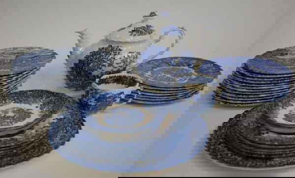 Blue and White China-. Wedgewood and Wood & Sons: 29 pieces Includes: 1 Desirable Sadler China 8-cup Swirl Blue Willow Teapot, 12 scenic salad plates, 2 Wedgewood Romantic England Saucers, 1 Wedgewood Romantic England Tea Cup, 5 Wedgewood Romantic En