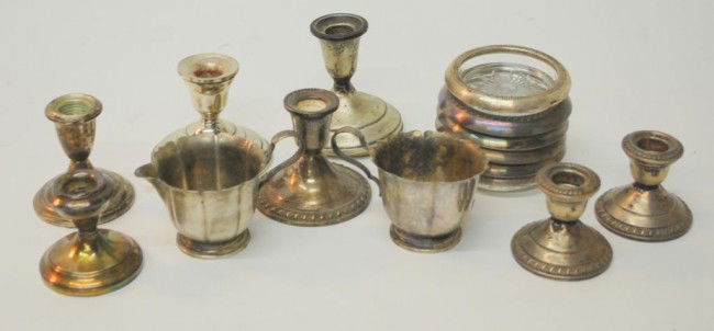 Silver Candlesticks and Creamer, Suger: 7 weighted candlesticks, Dublin Design Sterling Creamer and Sugar, and Sterling edged crystal coasters. Approximate weight of the creamer and sugar 206 grams.