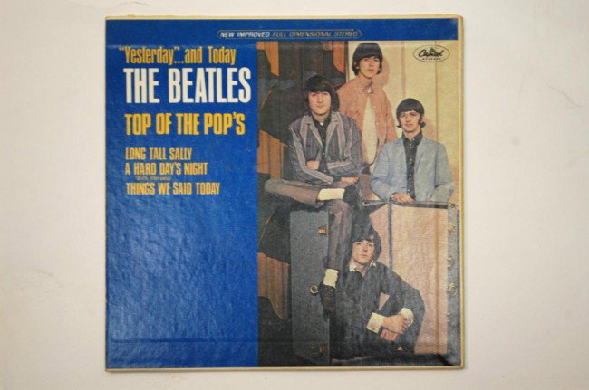 The Beatles Yesterday & Today 7 Promo EP": The Beatles Yesteday and Today Top of the Pop's. Yello Promo Label. Capitol P9431. Includes: A Hard Day's Night, Things We Said Today, & Long Tall Sally. Vinyl & Cover VG+.