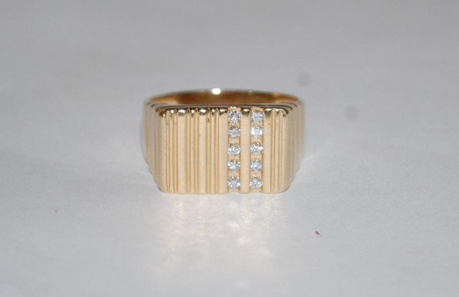 Men's 14K Gold and Diamond Ring: Ring contains 10 round brilliant cut diamonds channel set in 2 rows on one side, approx .20 ct. Comes with certified appraisal.