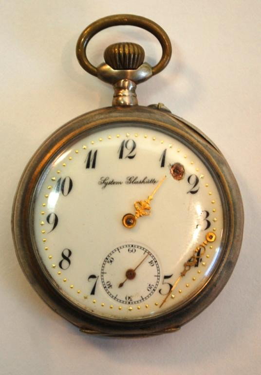System Glashutte .800 Silver Pocket Watch: System Glashutte, 15 Jewel, .800 silver case, interior of case also marked Galonne, inside of case marked 38*40, stem wind, the back of the case is decorated with a Knight. Loss to enamel between "1" 