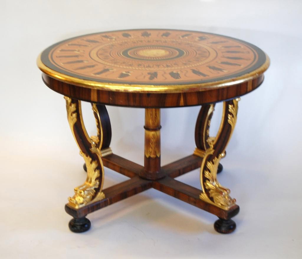 Parcel Gilt and Painted Gueridon Table Etruscan Top: Table top with painted Etruscan style design. Top with a central classical mask surrounded by various beeded cirles and a foliate circle, all of which is surround by an outer rim of classically garbed