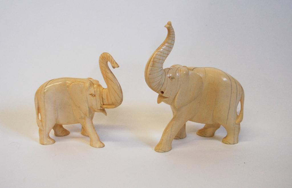 2 Carved Ivory Elephants: missing some tusks, 4 3/4 and 6.5" tall