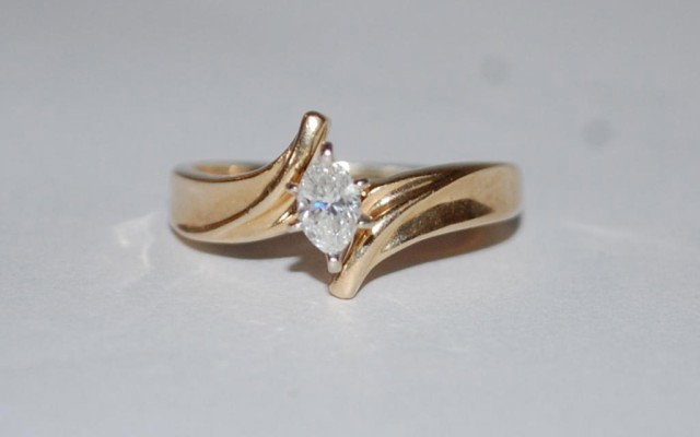 14K Gold and Diamond Solitaire Ring: 14K Gold and Diamond Solitaire Ring .3 Ct Marquise Cut Diamond. Total weight of ring 3 grams. Ring size 7. Comes with certified appraisal