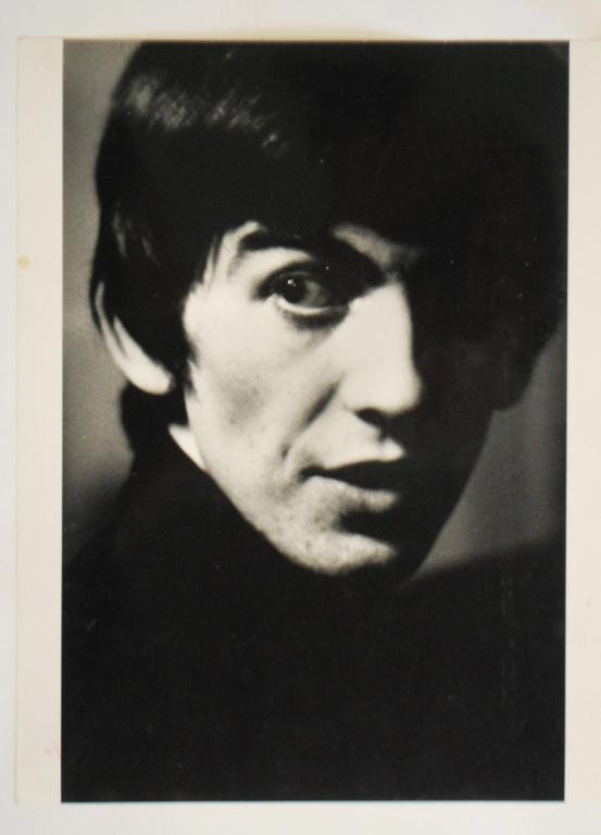 Hatami Signed Photograph- Beatle George Harrison: Signed on the back and labeled George Harrison Beatles 1962 AP. 1995 printing of the photo. 11" x 14"