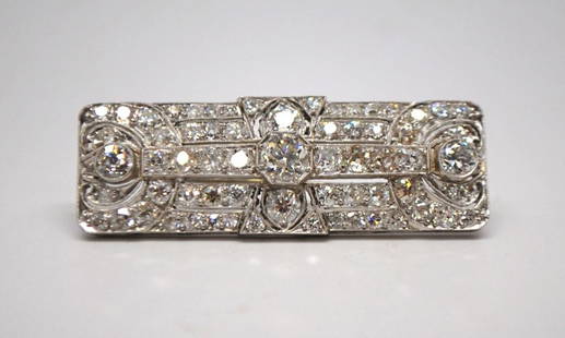 Diamond and Platinum Art Deco Estate Brooch: Platinum and Diamond Estate Brooch from the early 1930s containing 65 diamonds with 61 old mine cuts and 4 single cut round diamonds. Approximate diamond weight 4.19 carats. Diamonds are J Kand L in c