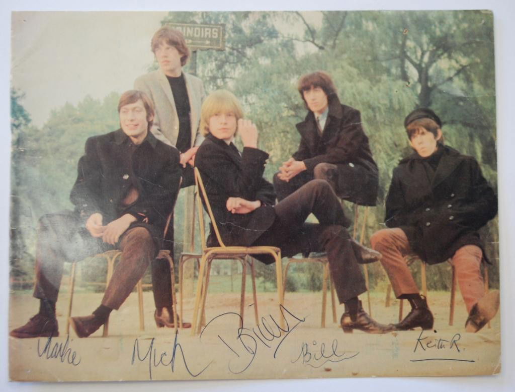 1960s Rolling Stones Autographs: Promotional Image from the 1960s autographed with first names only, by the Rolling Stones. Autographs include Mick, Keith, Brian, Bill and Charlie. Signed in ink. 10.5 x 8". Pinholes top right and lef