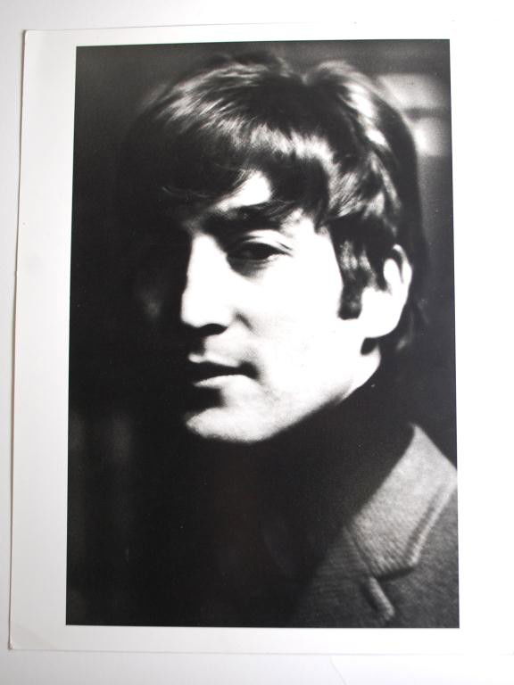John Lennon 1962 Hatami Photograph: Shahrokh Hatami Signed Photograph of Beatle John Lennon. Signed by photographer and labeled Photographed in Liverpool 1962. 1995 printing of the photo 11" x 14"