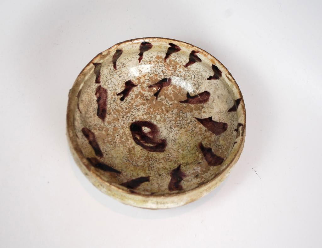 Precolumbian Glazed Decorated Pottery Bowl: white glazed with a purple-brown finger decoration on the interior. 6" diameter, some wear to rim and base, crazing. Originally owned by famous scuptor Jacques Lipchitz. Given to current owner by Yull