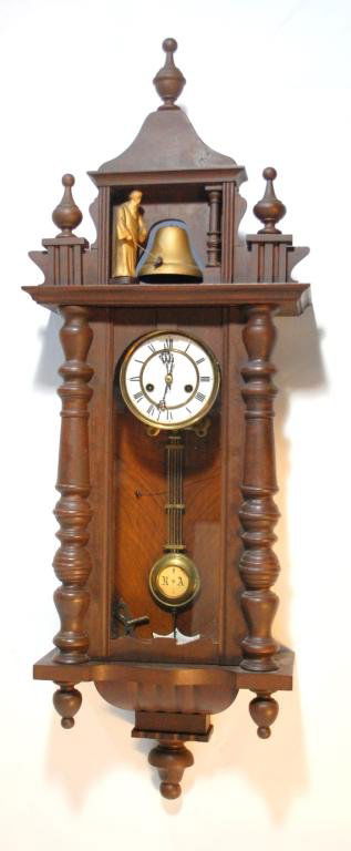 Junghans German Animated Monk Wall Clock: 45" tall, circa 1890, Junghans Trademark roman numeral porcelain dial, carved wood monk striking cast metal bell, dial has crossed arrows mark, pendulum has porcelain inset with letters R and A.