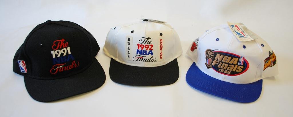 3 Chicago Bulls NBA Finals Caps: 1991 NBA Finals Cap very slightly worn, 1992 NBA Finals Bulls Champions Cap new with tag, and 1996 NBA Finals Bulls vs Sonics Cap new with tags.