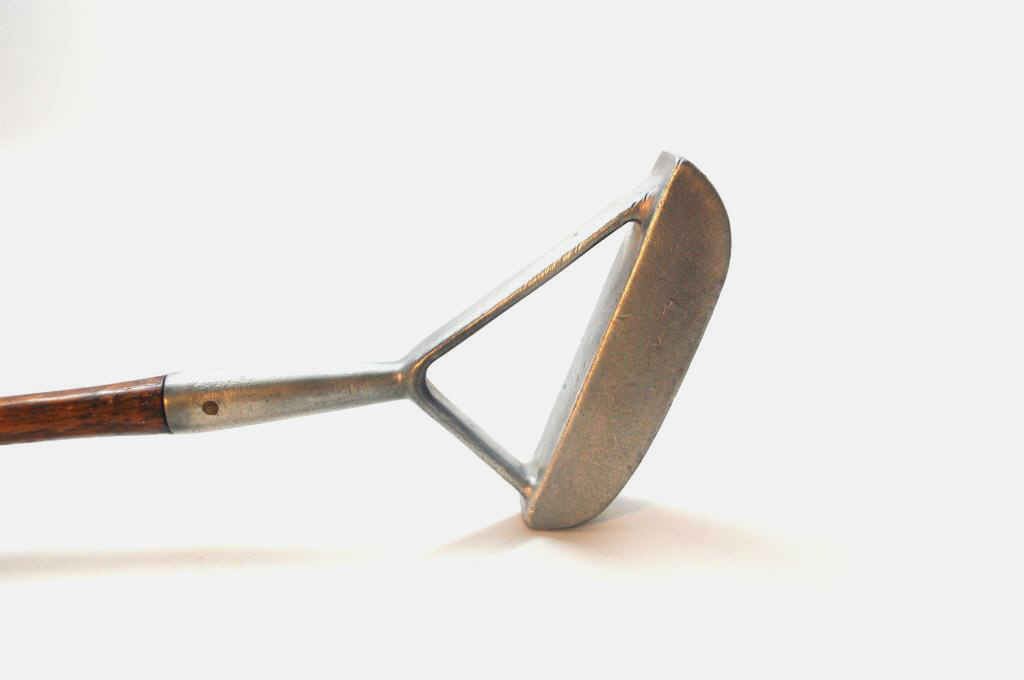 Likely Otto Hackbarth Bifurcated Hosel Putter: Attributed to Otto Hackbarth designed Putter. 1930's. Forked hosel. Outlawed shortly after introduction. Golfers would often fill the triangle created by the forked hosel in order to disguise it. Golf