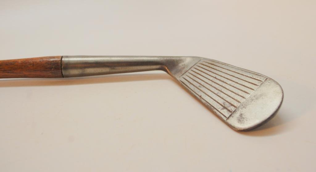 Cyril Walker Special Mid Iron: Toe stamped "Approved by Pro Golfers Association of America". Sole marked "Mid Iron P21". Design configuration of back of club is unusual and attractive Diamond shape pattern. Cyril Walker won the 192