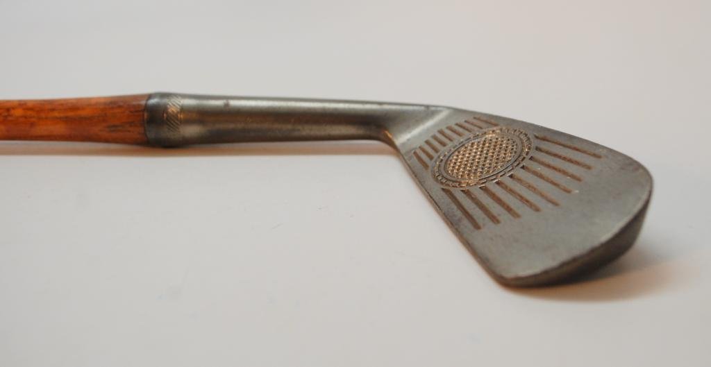Charles G. Nieman Kroydon Mid Iron: Marked "Charles G. Nieman" who is likely a club pro, "Superfine", "J7 Forged Head Only", and "25 Mid Iron". LIne Scoring from heel to toe on Face with Large Waffle Iron Circular Sweet Spot.