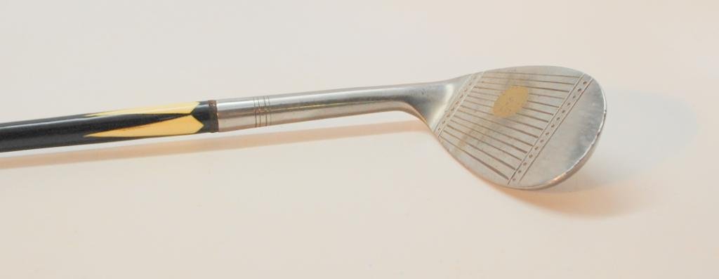 Burr-Key Bilt Mashie Niblick: Number 7 Mashie Niblick. Stainless steel. Marked "Balancer Shafted" and "115-130yds.". Line Scored Face from heel to toe with Dot Punch borders. Solid Brass Face insert in sweet spot. Early steel shaf