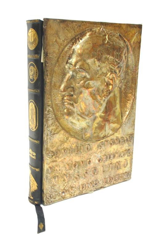 Copper Relief Book on Mussolini by Susmel: Large Book in Italian, 1973 "A Man Named Mussolini" by Duilio Susmel, Deluxe Edition, with Copper Bas Relief Cover Profile of Mussolini, and Obelisk on back cover, blue leather binding. 40 pages, with