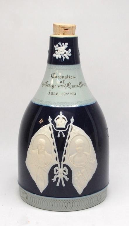 1911 Copeland Spode Coronation George Vth Decanter: glazed in two-tone blue relief-molded with portraits and royal arms, missing original stopper. 8" tall