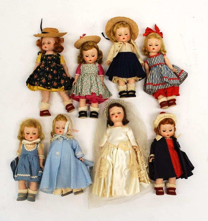 8 Madame Alexander Kins Vintage Dolls: marked Alex on back, sleepy eyes, jointed, 7 1/2" tall, various outfit including bride, some original tags. Very good condition.