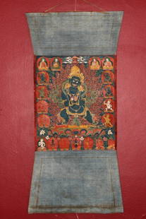 Tibetan Painted  Tangka,: of rectangular form, decorated with a central deity, surrounded by other deities and lotus scrolls in tones of blue, red and green