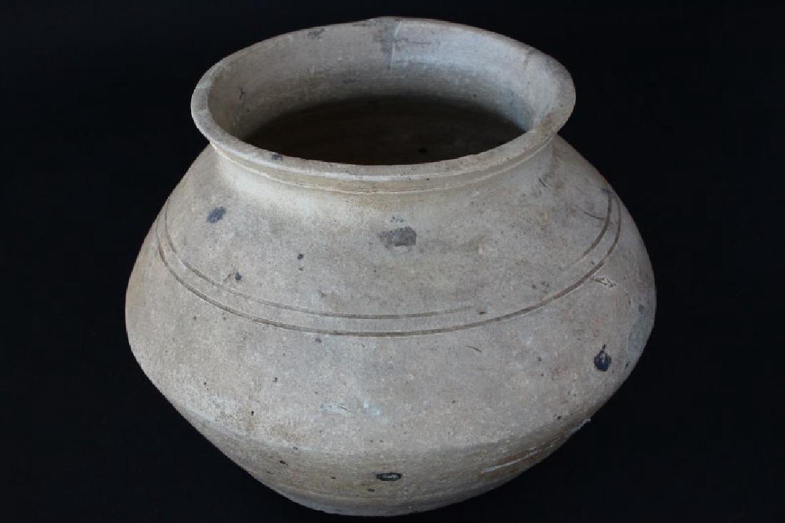 Chinese Han Dynasty Jar,: with spreading lip, above baluster body, with incised rib decoration, h 13cm