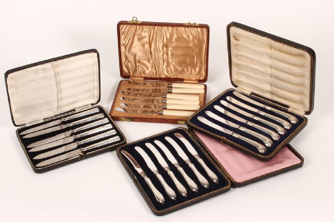Three Cased Sets of Sterling Silver Handled: Butter Knives, together with a cased set of six butter knives with ivorine handles, (4)