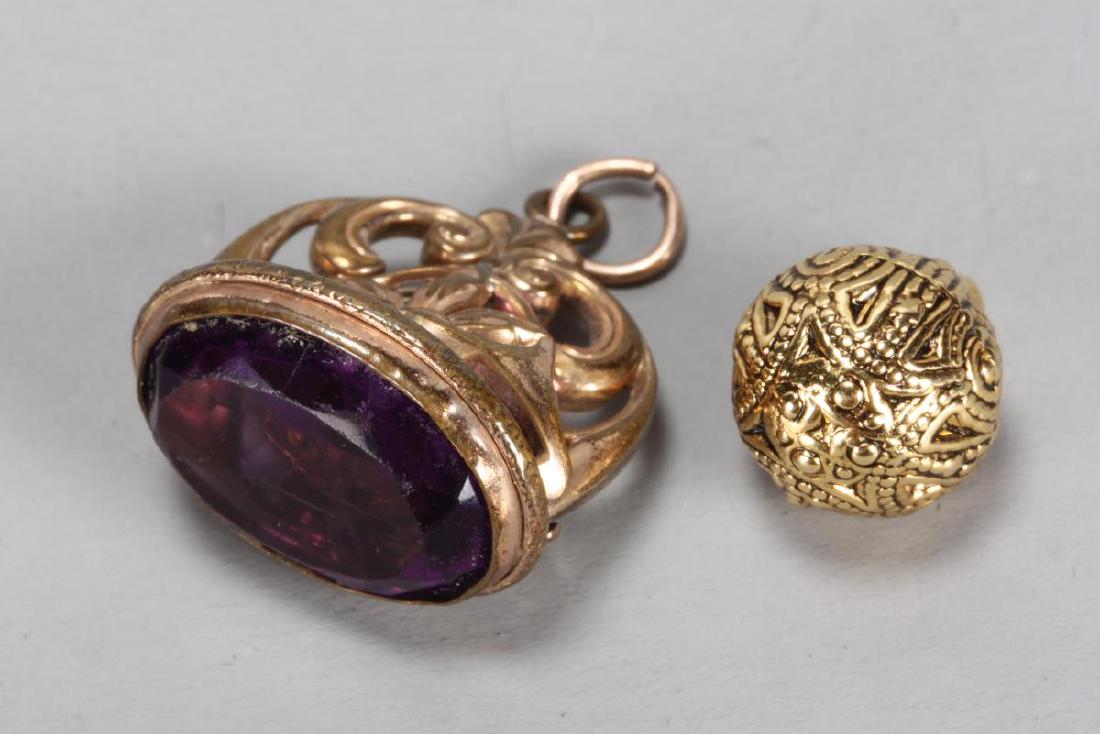 Victorian Amythest Fob,: together with a gilt spherical pendant (2)